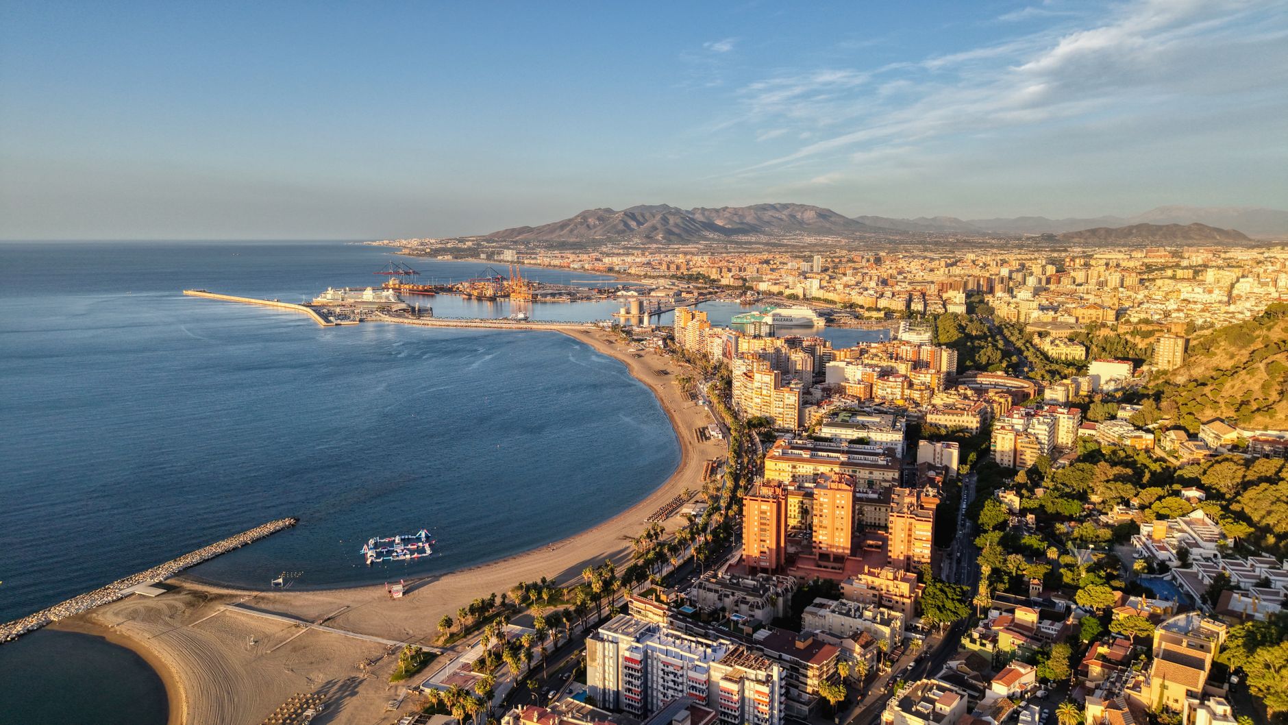 Aerial view of coastal city and harbor along the Mediterranean shore