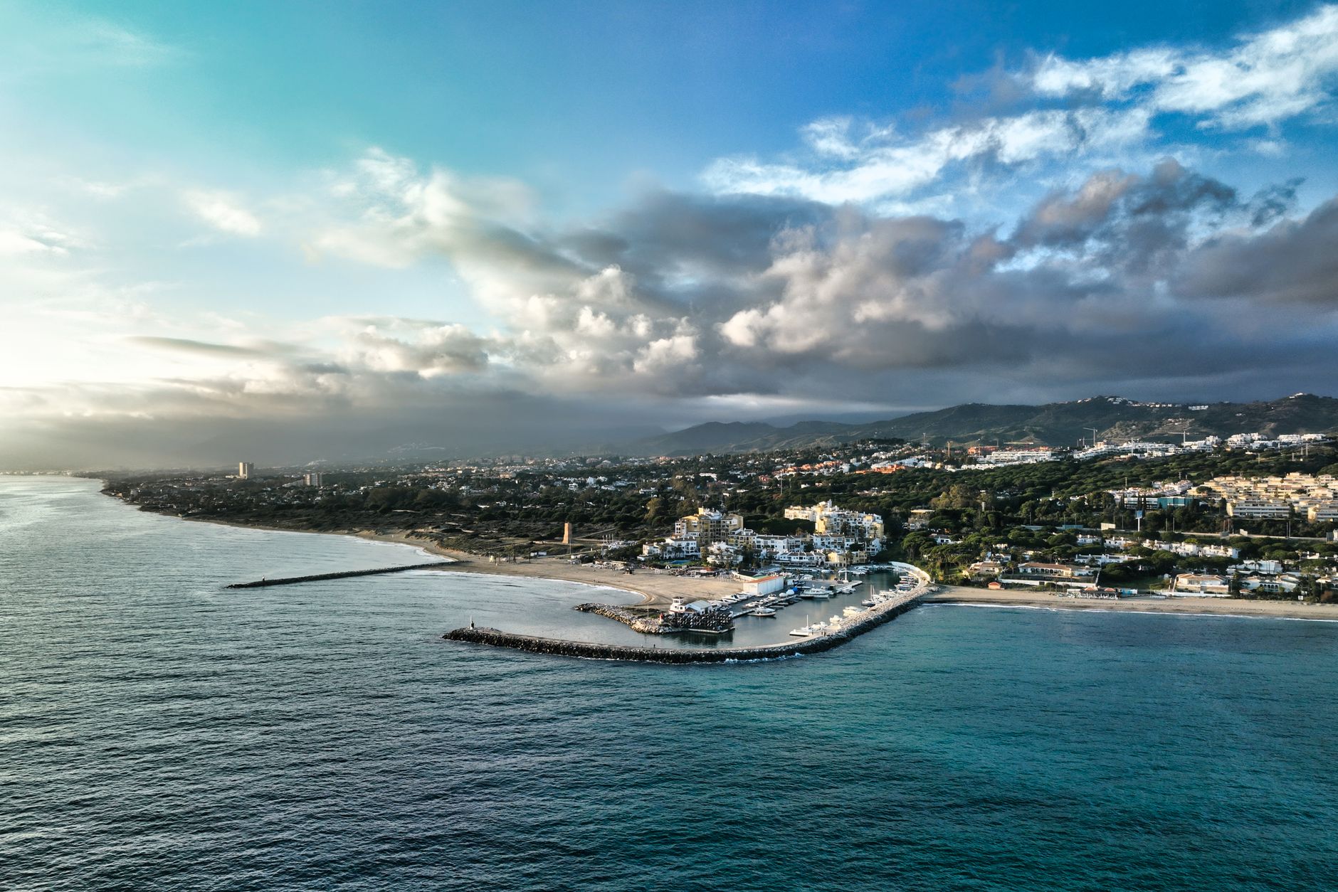 Aerial view of Marbella coastline and marina along the Costa del Sol