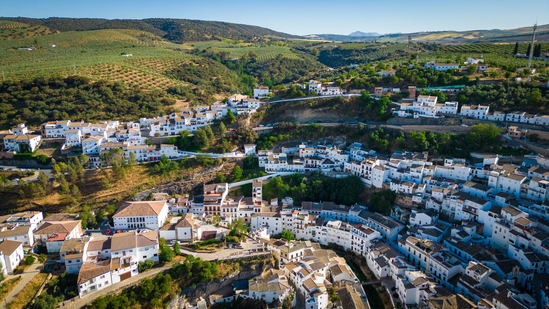 Aerial view of whitewashed houses on rolling Andalusian hills